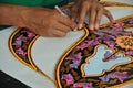 Malaysian kite maker working on a kite in his workshop Royalty Free Stock Photo